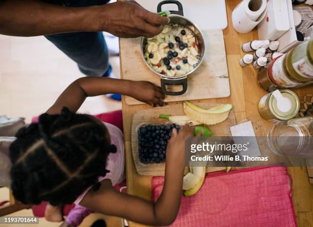 Aerial View Young Girl Helping Her Dad With Dessert