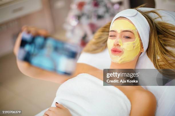 taking selfie at beauty salon. - facial cleanse stock pictures, royalty-free photos & images