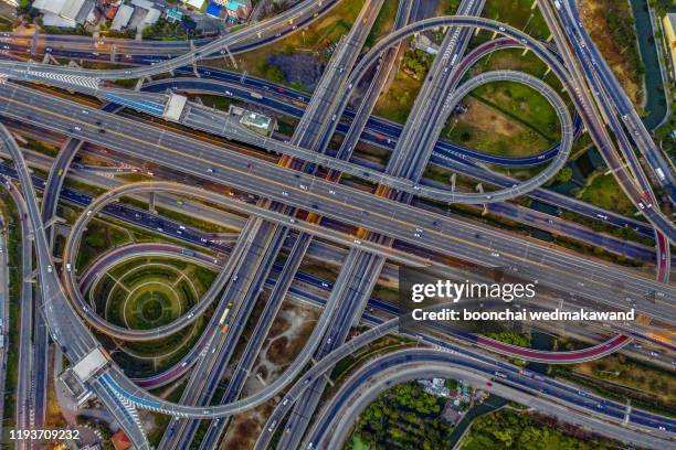 aerial view of highway at rush hour at night time with car trail and traffic. view from drone - car aerial view stock pictures, royalty-free photos & images