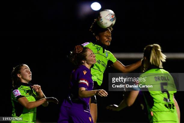 Simone Charley of Camberra United headers the ball towards goal during the round five W-League match between the Perth Glory and Canberra United at...