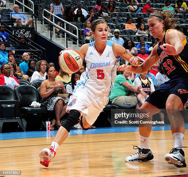 Shalee Lehning of the Atlanta Dream drives against Jeanette Pohlen of the Indiana Fever at Philips Arena on July 19, 2011 in Atlanta, Georgia. NOTE...