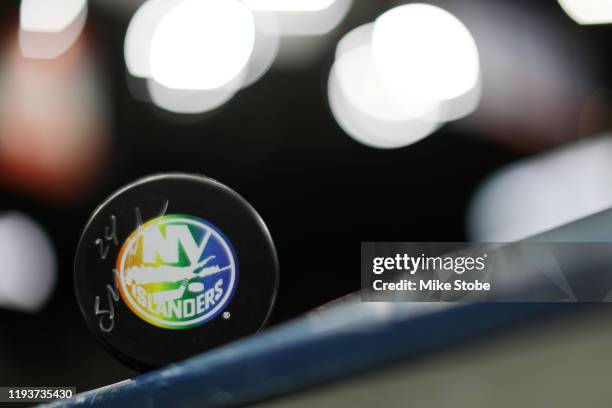 Detailed view of of the Pride Night Hockey puck prior to the game between the New York Islanders and the Detroit Red Wings at NYCB Live's Nassau...