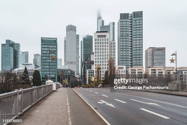 frankfurt am main skyline with fog from the untermainbrucke bridge - high street banks stock pictures, royalty-free photos & images