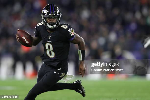 Quarterback Lamar Jackson of the Baltimore Ravens breaks NFL single season record for rushing yards by a quarterback, formerly held by Michael Vick,...