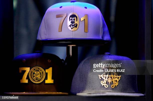 Caps by "El Chapo 701," a line in clothing, jewelry and liquor bearing the nickname of the jailed Mexican drug lord Joaquin "El Chapo" Guzman Loera,...