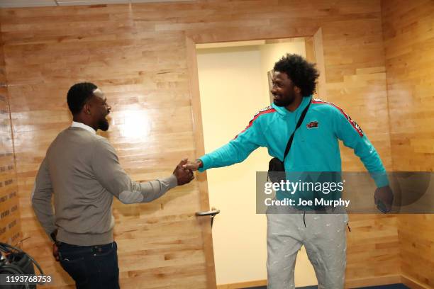 Former NBA player, Tony Allen shakes hands with Solomon Hill of the Memphis Grizzlies as he arrives to the game against the Houston Rockets on...