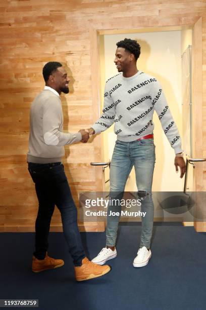 Former NBA player, Tony Allen shakes hands with Jaren Jackson Jr. #13 of the Memphis Grizzlies as he arrives to the game against the Houston Rockets...