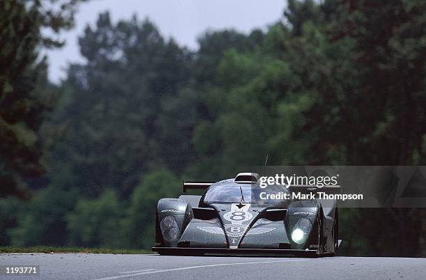 Butch Leitzinger, Eric van der Poele and Andy Wallace drive the Team Bentley car during the Le Mans 24 Hour Race at Circuit de la Sarthe in Le Mans,...