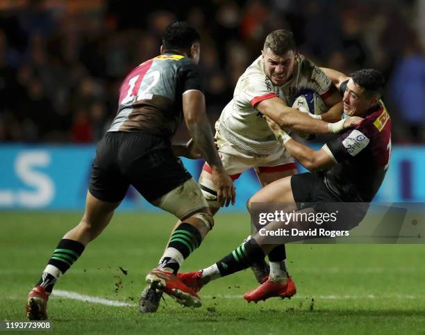 Sean Reidy of Ulster is tackled by Semi Kunatani of Harlequins during the Heineken Champions Cup Round 4 match between Harlequins and Ulster Rugby at...