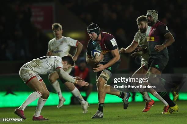 Stephan Lewies of Harlequins takes on the Ulster Rugby defence during the Heineken Champions Cup Round 4 match between Harlequins and Ulster Rugby at...