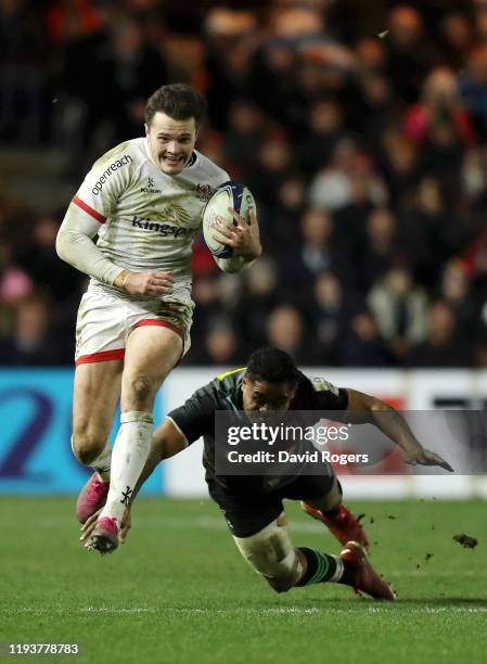 Jacob Stockdale of Ulster breaks away from Francis Saili of Harlequins during the Heineken Champions Cup Round 4 match between Harlequins and Ulster...