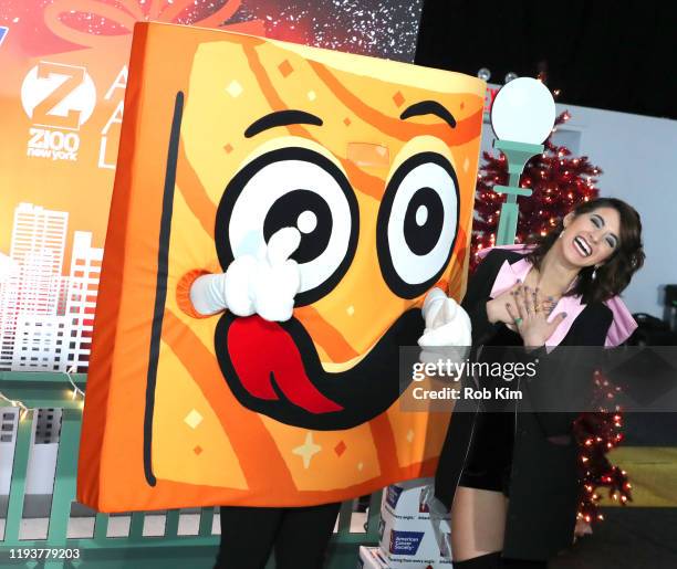 Samantha Rosalie poses with a Cinnamon Toast Crunch mascot during the z100 All Access Lounge presented by Poland Spring Pre-Show at Pier 36 on...