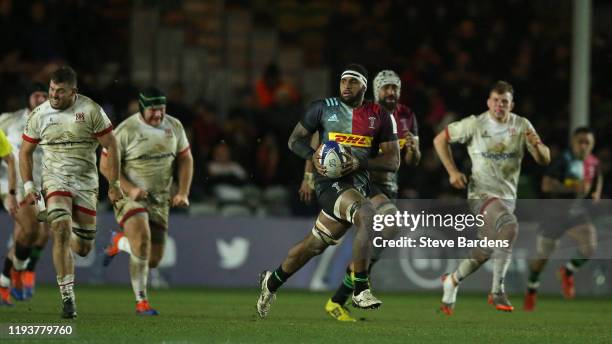 Semi Kunatani of Harlequins makes a break during the Heineken Champions Cup Round 4 match between Harlequins and Ulster Rugby at Twickenham Stoop on...