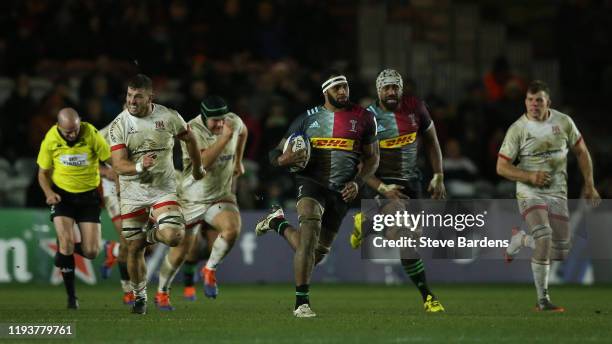 Semi Kunatani of Harlequins makes a break during the Heineken Champions Cup Round 4 match between Harlequins and Ulster Rugby at Twickenham Stoop on...