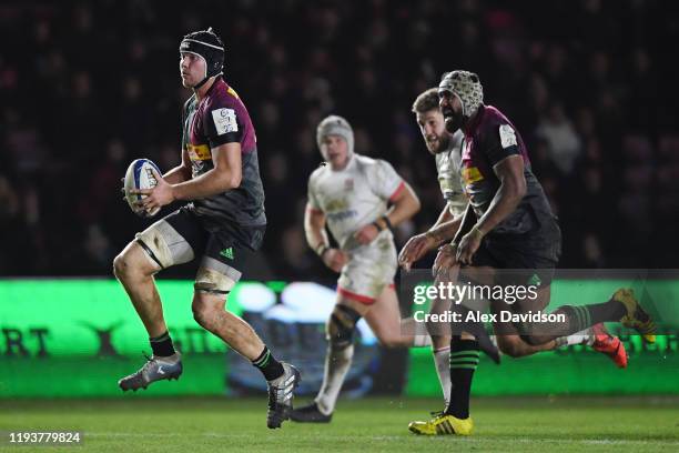 Stephan Lewies of Harlequins makes a break during the Heineken Champions Cup Round 4 match between Harlequins and Ulster Rugby at Twickenham Stoop on...