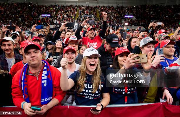 Supporters cheer as US President Donald Trump holds a "Keep America Great" campaign rally in Milwaukee, Wisconsin, January 14, 2020.