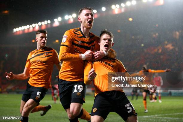 Keane Lewis-Potter of Hull City celebrates after scoring his team's second goal with Josh Bowler and Reece Burke during the Sky Bet Championship...