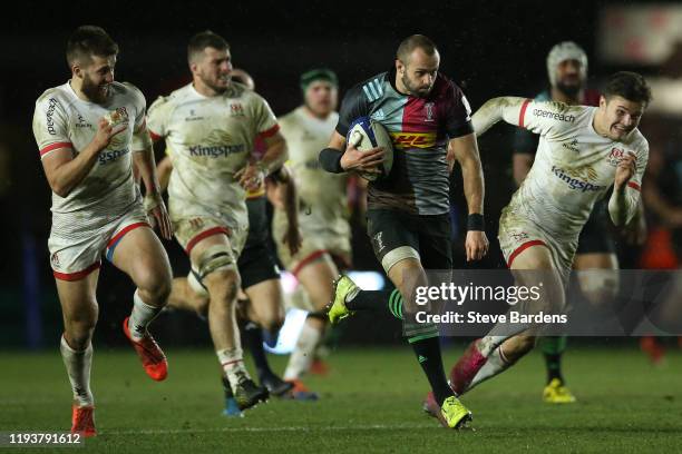 Ross Chisholm of Harlequins makes a break during the Heineken Champions Cup Round 4 match between Harlequins and Ulster Rugby at Twickenham Stoop on...