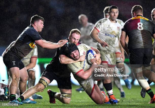 Tom O'Toole of Ulsteris tackled by Will Evans of Harlequins during the Heineken Champions Cup Round 4 match between Harlequins and Ulster Rugby at...