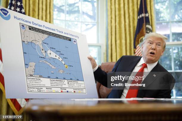 President Donald Trump speaks to members of the media about Hurricane Dorian in the Oval Office of the White House in Washington, D.C., U.S., on...