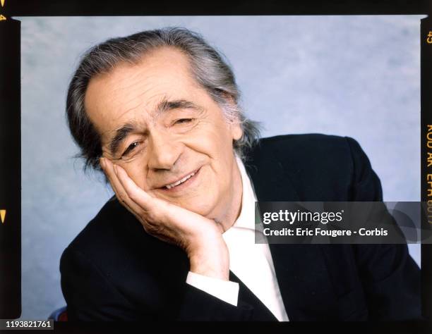 Singer Serge Reggiani poses during a portrait session in Paris, France on .