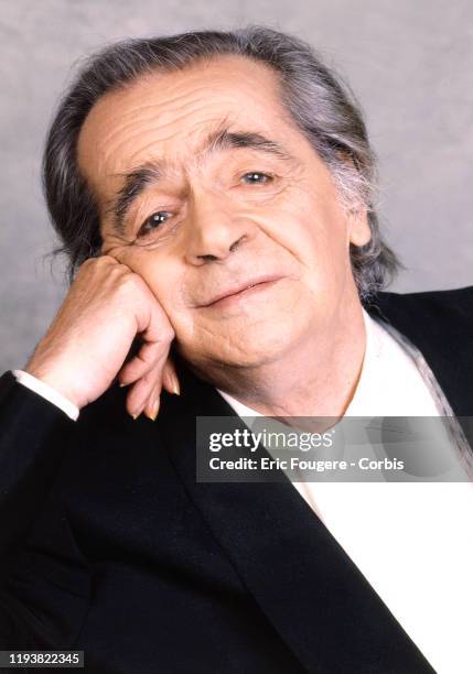 Singer Serge Reggiani poses during a portrait session in Paris, France on .