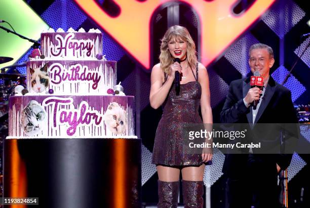Talyor Swift and Elvis Duran speak onstage during iHeartRadio's Z100 Jingle Ball 2019 at Madison Square Garden on December 13, 2019 in New York City.