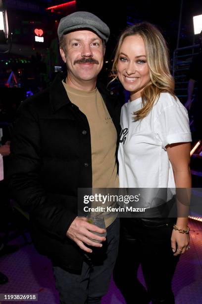 Jason Sudeikis and Olivia Wilde pose backstage at iHeartRadio's Z100 Jingle Ball 2019 Presented By Capital One on December 13, 2019 in New York City.