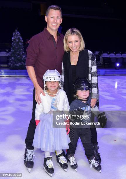 Michael Cameron, Kenzie Cameron, Beverley Mitchell, and Hutton Michael Cameron pose for portrait at 2019 Disney On Ice "Mickey's Search Party" at...