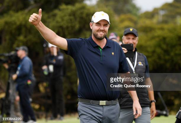 Marc Leishman of Australia and the International team celebrates after he and Abraham Ancer of Mexico and the International team halved their match...