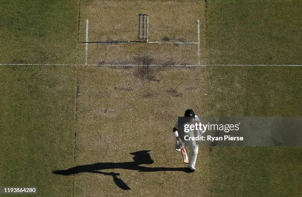 David Warner of Australia runs between the wickets during day three of the First Test match in the series between Australia and New Zealand at Optus...