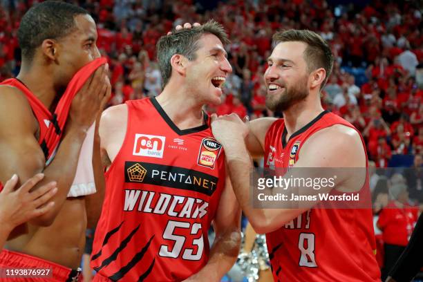 Damian Martin of the Perth Wildcats and Mitch Norton of the Perth Wildcats share a laugh after the game during the round 11 NBL match between the...