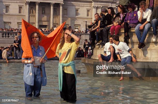 Before it erupts into a full-scale riot, families and peaceful protesters against Margaret Thatcher's Poll Tax policy, gather in Trafalgar Square, on...