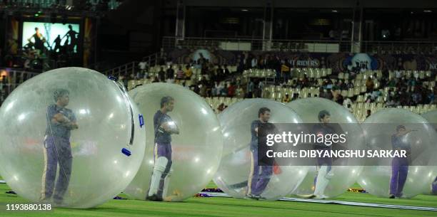 Indian dancers perform before the start of the IPL Twenty20 cricket match between Kolkata Knight Riders and Delhi Daredevils at The Eden Gardens in...