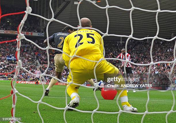 Sunderland's English forward Darren Bent shoots and his shot hits a red beach-ball and deflects into the net for the only goal of the English Premier...