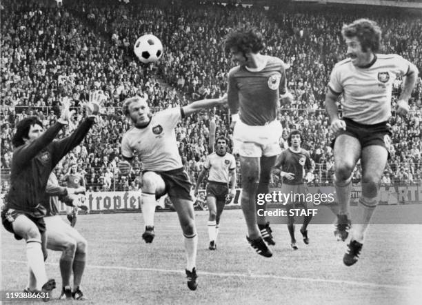 West German forward Gerd Mueller scores on a header past Australian goalkeeper Jack Reilly and defenders Manfred Schaefer and Ray Richards during the...