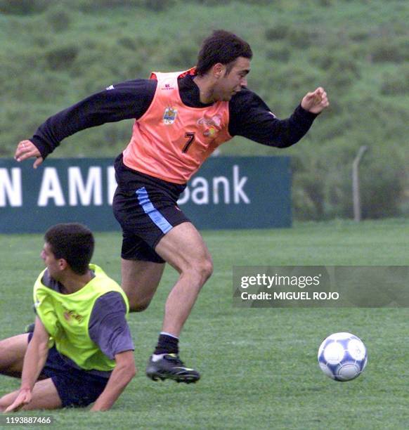 Alvaro Recoba , dribbles the ball pass another player during practice 30 October 2001. Alvaro Recoba , jugador de la seleccion uruguaya de futbol,...