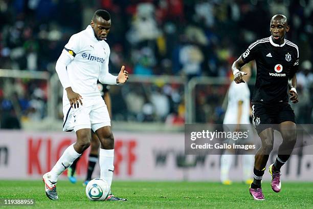 Bongani Khumalo of Tottenham and Mark Mayambela of Pirates in action during the 2011 Vodacom Challenge match between Orlando Pirates and Tottenham...