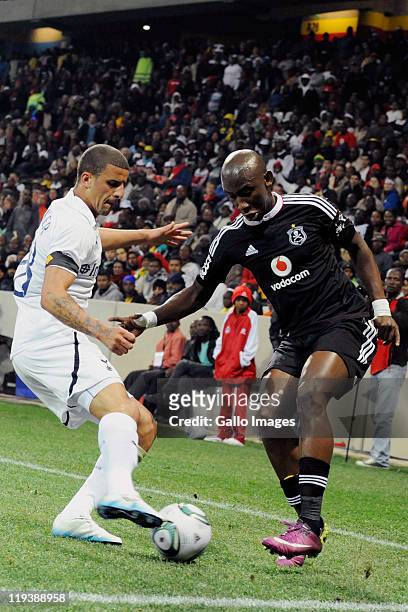 Kyle Walker of Tottenham and Mark Mayambela of Pirates in action during the 2011 Vodacom Challenge match between Orlando Pirates and Tottenham...