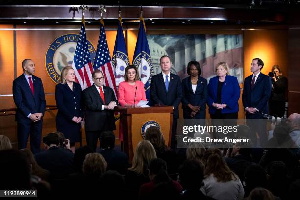 Surrounded by the seven impeachment managers, Speaker of the House Nancy Pelosi speaks during a press conference to announce the House impeachment...
