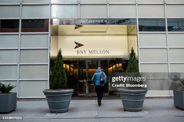 Pedestrian enters a Bank of New York Mellon Corp. Office building in New York, U.S., on Monday, Jan. 13, 2020. BNY Mellon is scheduled to release...