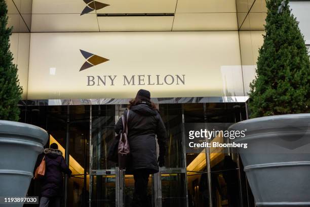 People enter a Bank of New York Mellon Corp. Office building in New York, U.S., on Monday, Jan. 13, 2020. BNY Mellon is scheduled to release earnings...