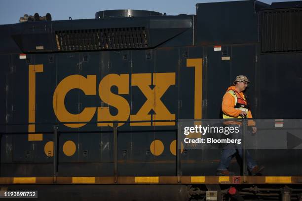 Conductor walks along a CSX Transportation Inc. Locomotive in Louisville, Kentucky, U.S., on Wednesday, Jan. 8, 2020. CSX Corp. Is scheduled to...