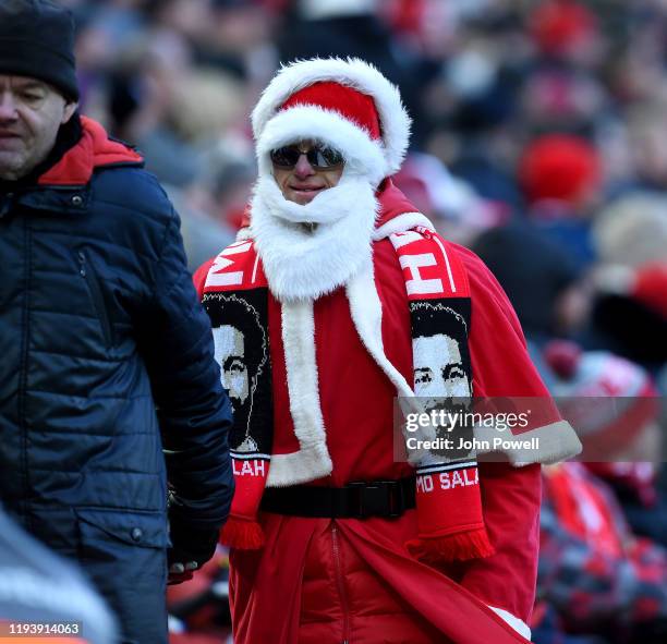 Father Christmas is a fan of Liverpool during the Premier League match between Liverpool FC and Watford FC at Anfield on December 14, 2019 in...