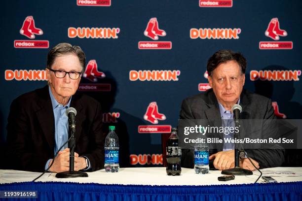 Principal owner John Henry and Chairman Tom Werner of the Boston Red Sox address the media during a press conference addressing the departure of...