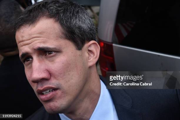 Opposition leader and reelected president of the National Assembly by anti-Maduro lawmakers majority Juan Guaido leaves a session called by...