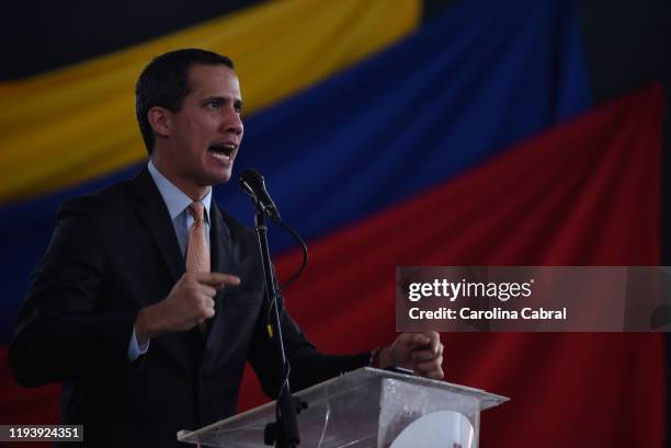 Opposition leader and reelected president of the National Assembly by anti-Maduro lawmakers majority Juan Guaido speaks during a session called by...