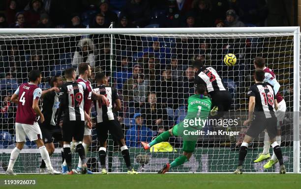 Chris Wood of Burnley scores his team's first goal past Fabian Schar of Newcastle United and Martin Dubravka of Newcastle United during the Premier...