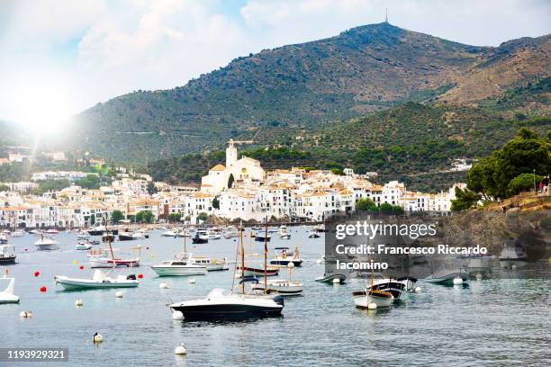 cadaques, gerona province, spain. sunny day with boat and coastline - cadaqués stockfoto's en -beelden