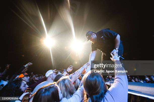 Country singer & songwriter Luke Combs performs to a sold out audience at Bridgestone Arena on December 13, 2019 in Nashville, Tennessee.